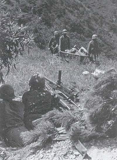 Medics evacuate wounded of the 5th Regimental Combat Team hit near Masan, 30 August, 1950.